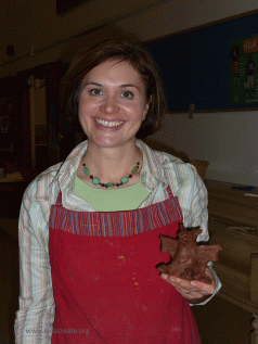 Nicole holding a clay gargoyle
